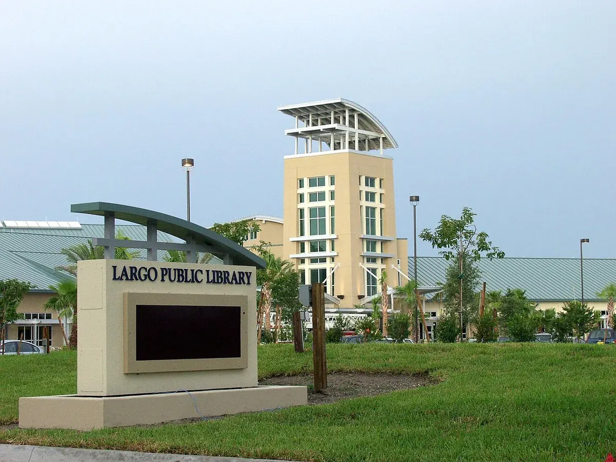 Largo Public Library sign and tan tower building in Largo, FL