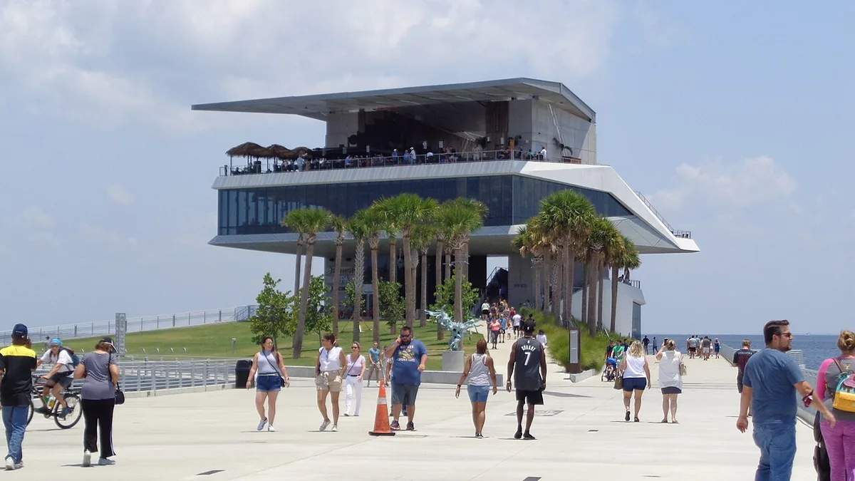 The St. Pete Pier pavilion and palms on the waterfront in St. Petersburg, FL