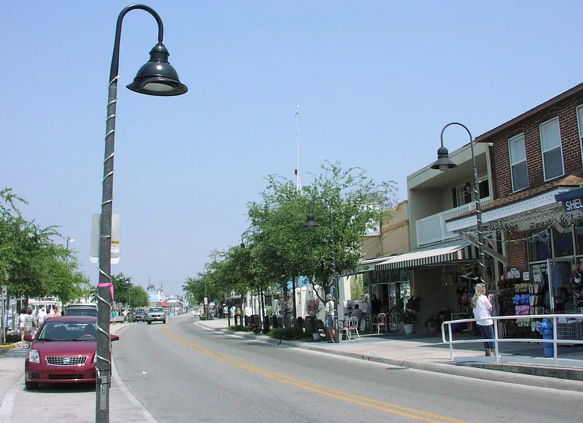 Dodecanese Avenue shopfronts with awnings and street lamps in Tarpon Springs, FL